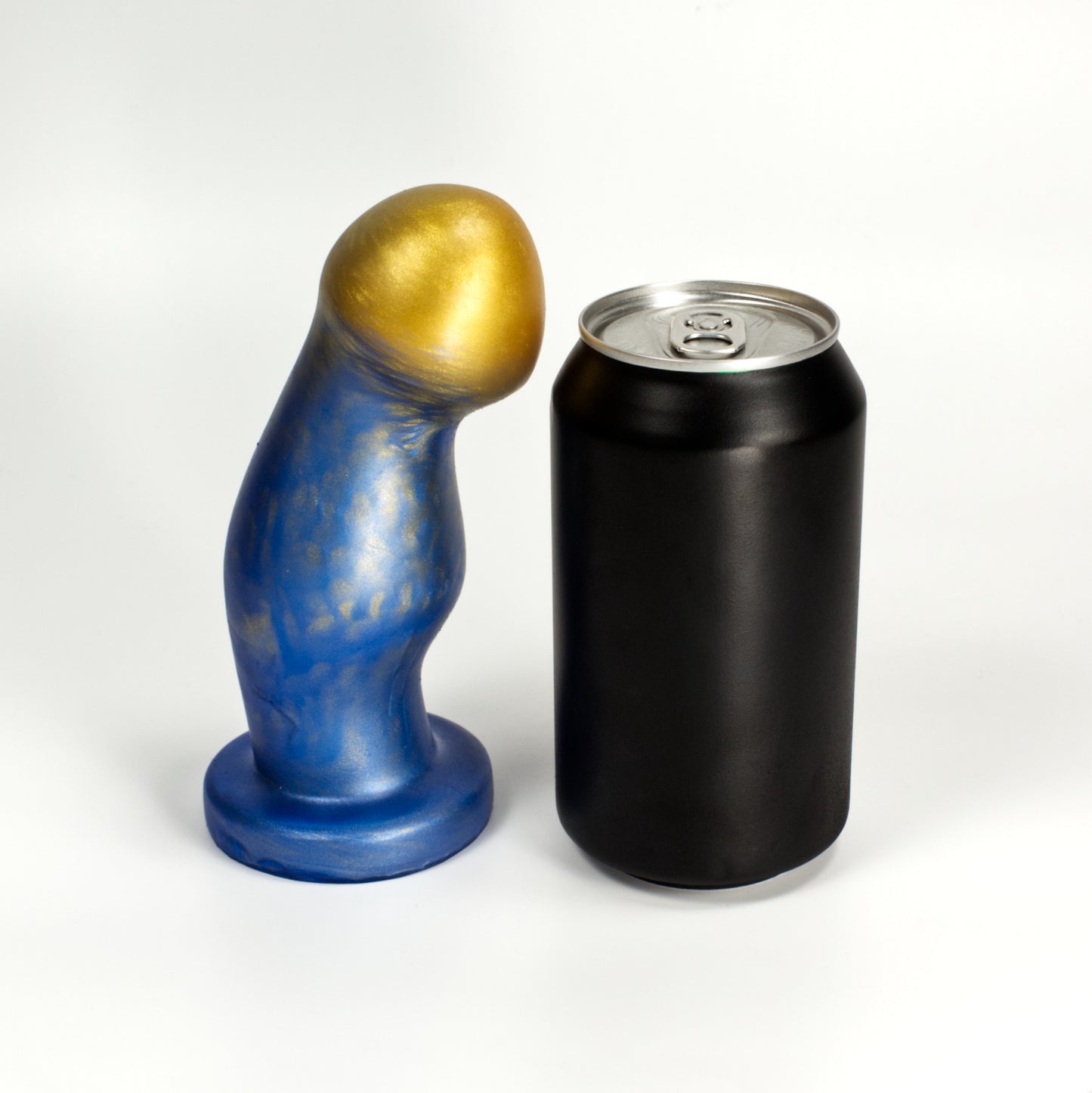 Side view of the Ally Medium next to a standard soda can, showing that the toy is a little taller than the can and three quarters as wide at the middle bump.