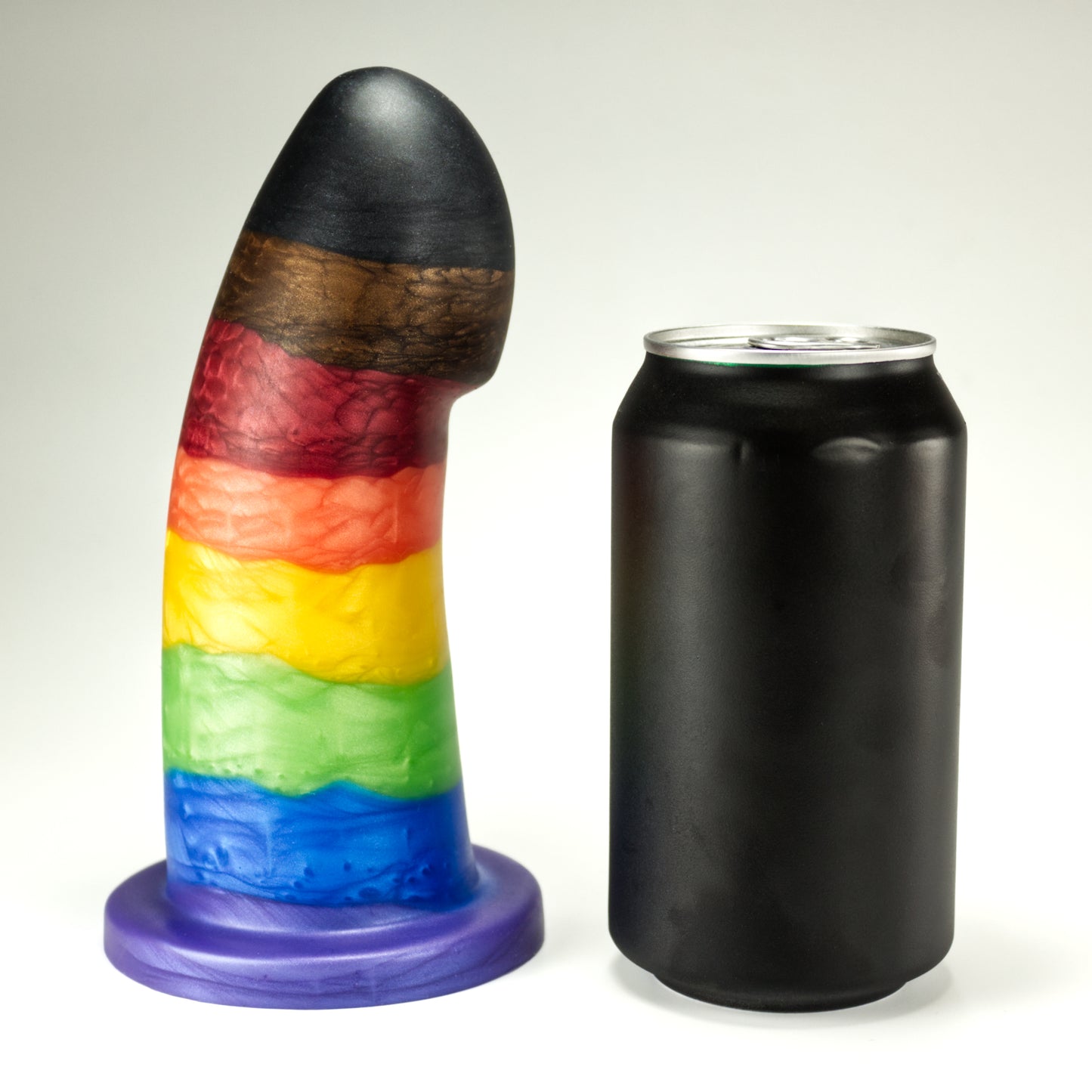 Side view of the Sidekick Extra Large next to a standard soda can, showing that the dildo is a little taller and nearly the same width as the can.