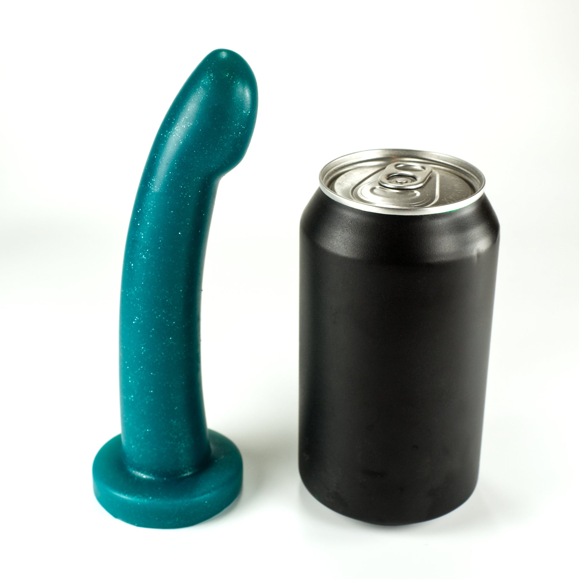Side view of the Sidekick XS next to a standard soda can, showing that the dildo is a little taller and a little more than a third of the width of the can.