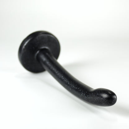 Top view of the Sidekick XXXS, a dildo with a smooth cylinder shaped body, and a fingertip-shaped tip, and a pronounced cliff shape where they meet.